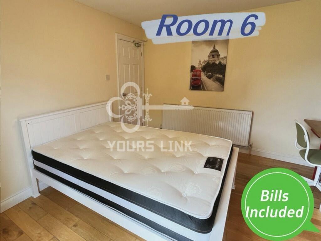 A bright and spacious double bedroom featuring ...