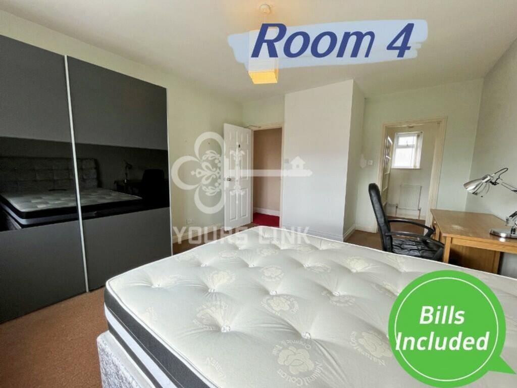 A bright and spacious double bedroom featuring ...