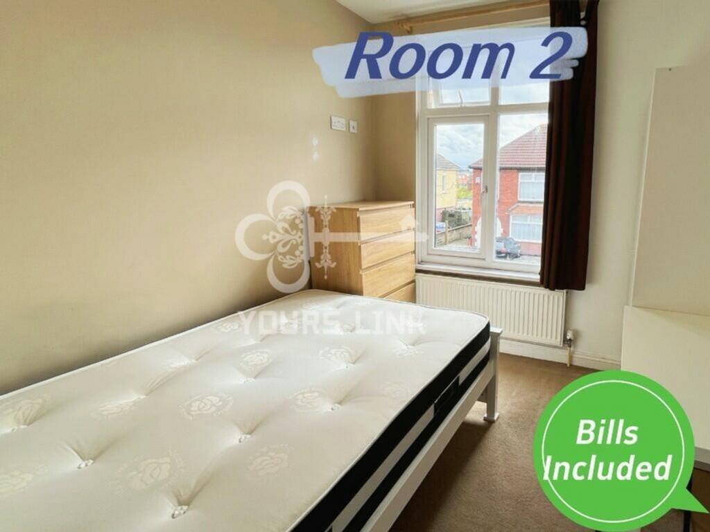 A bright and spacious double bedroom featuring ...