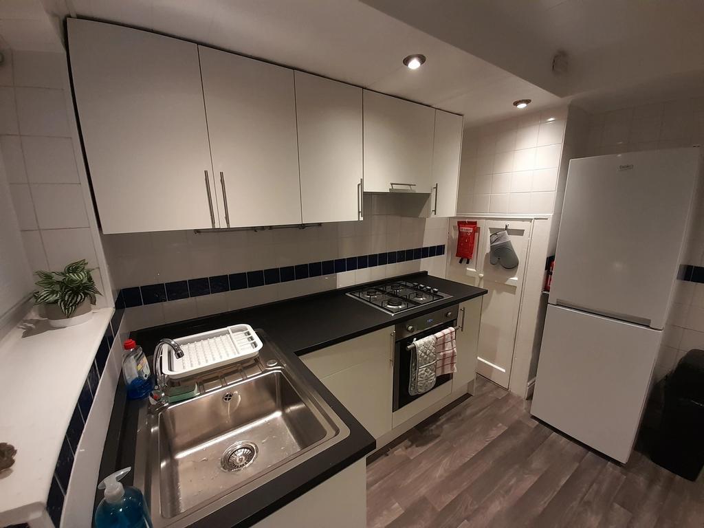 This modern kitchen features sleek cabinetry an...