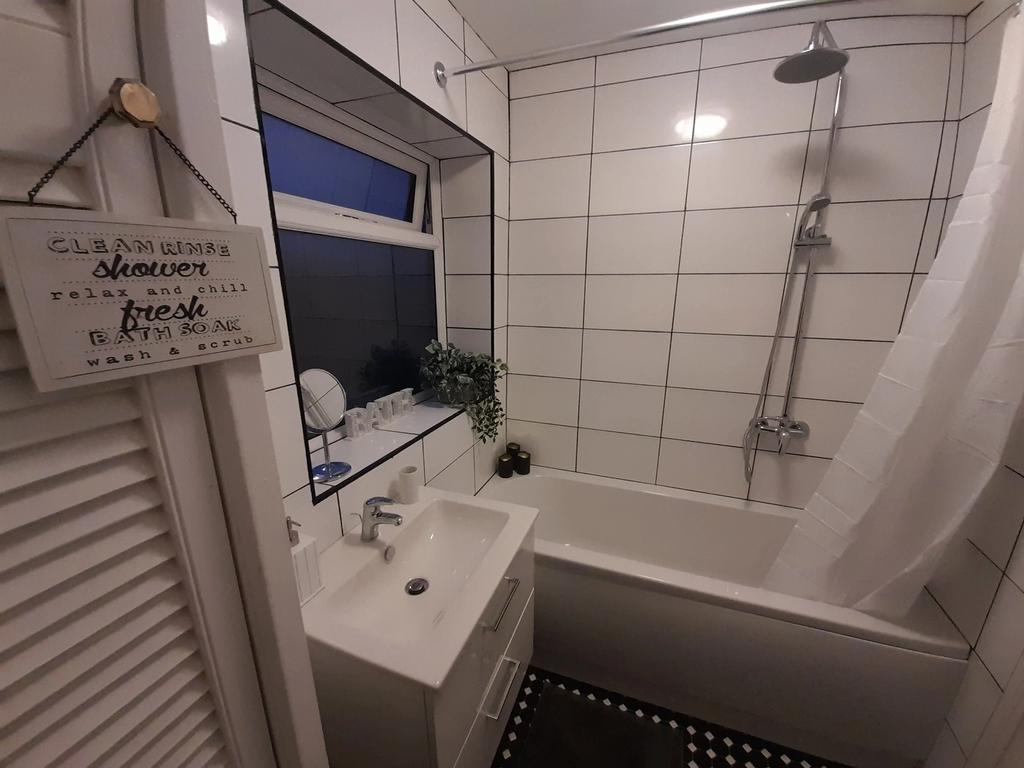 This beautifully designed bathroom features a m...