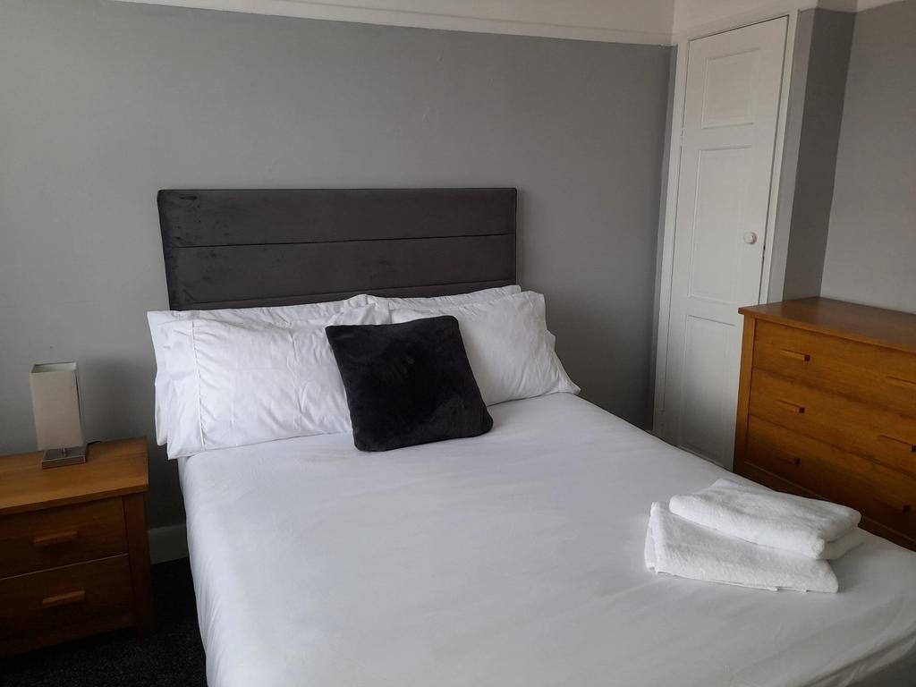 A beautifully arranged double bedroom featuring...