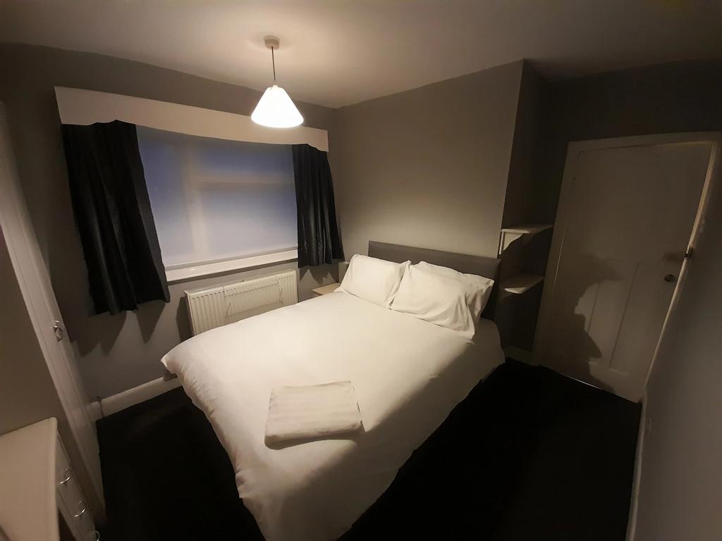 Cozy double bedroom featuring a spacious layout...