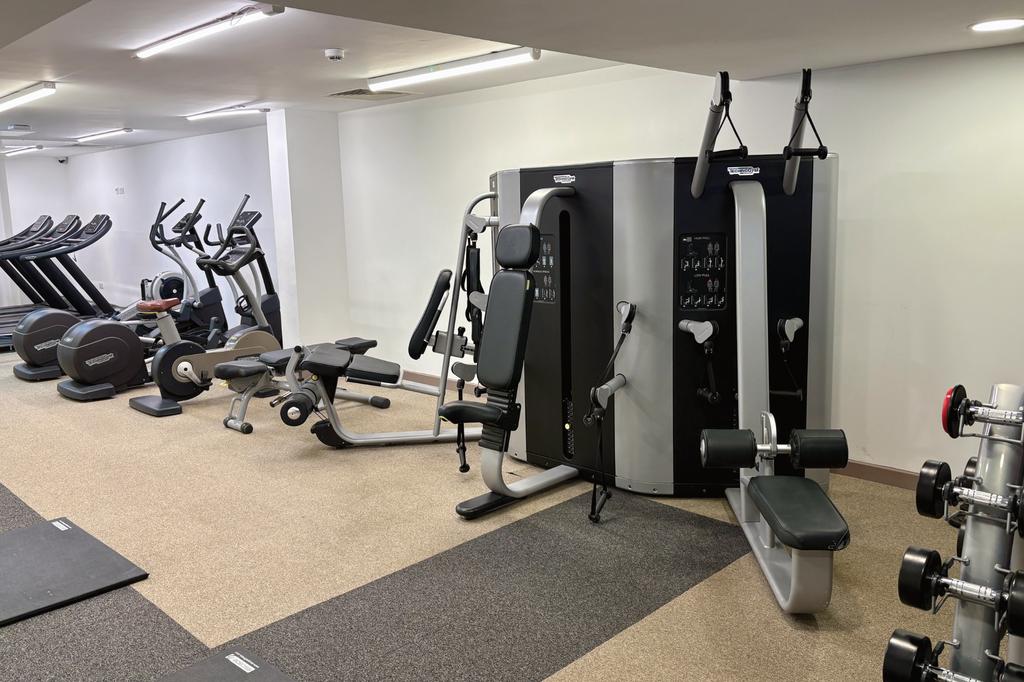 A well-equipped gym featuring a variety of mode...