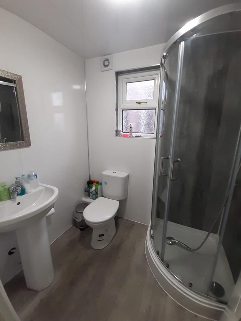 This modern bathroom features a sleek design wi...