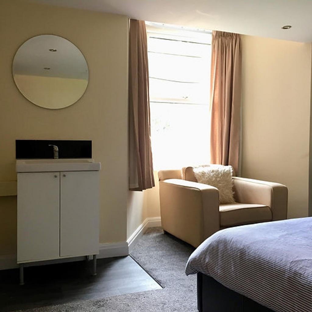 A beautifully designed double bedroom featuring...