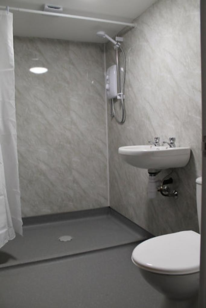 A modern bathroom showcasing sleek design with ...