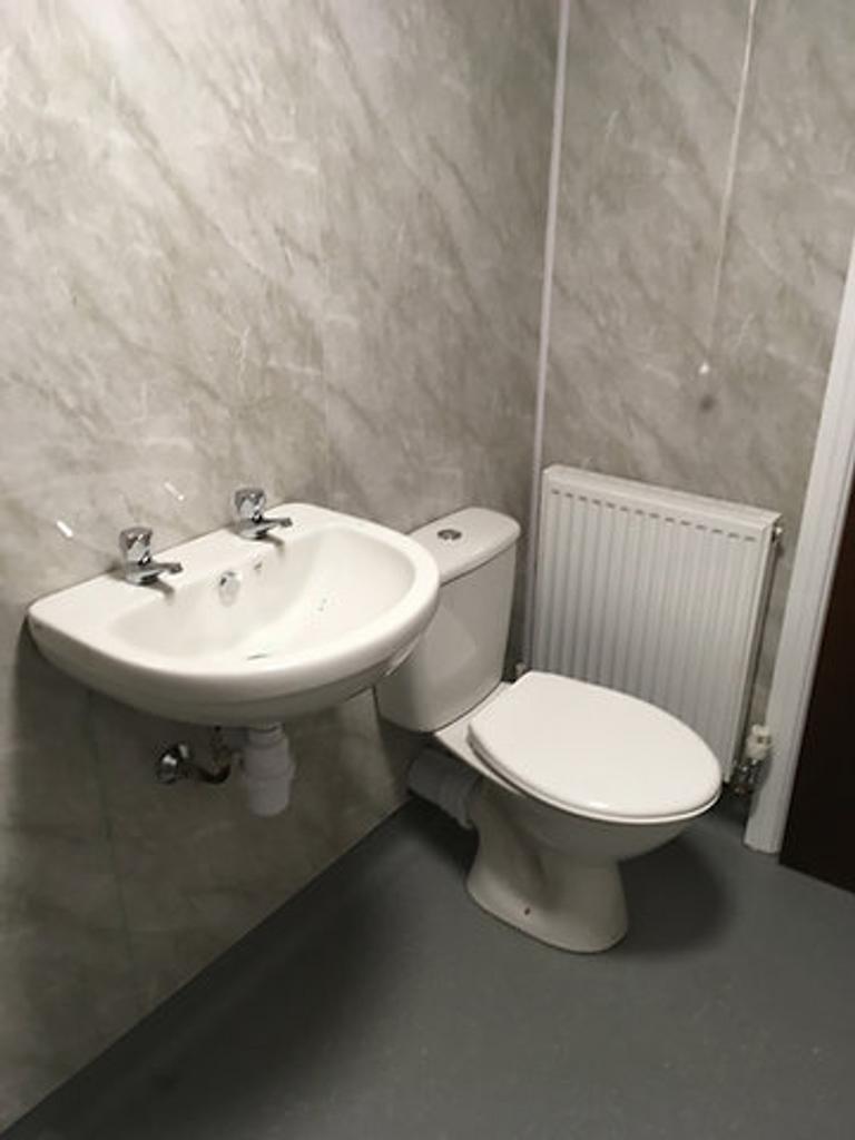 A compact and functional single toilet area fea...