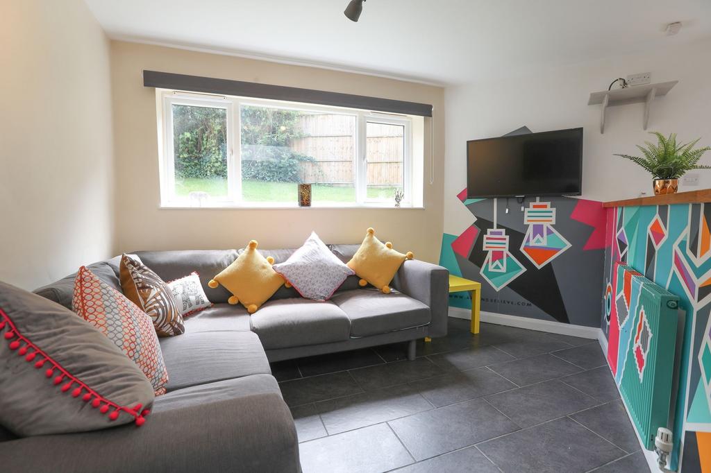 This cozy living room features a stylish grey s...