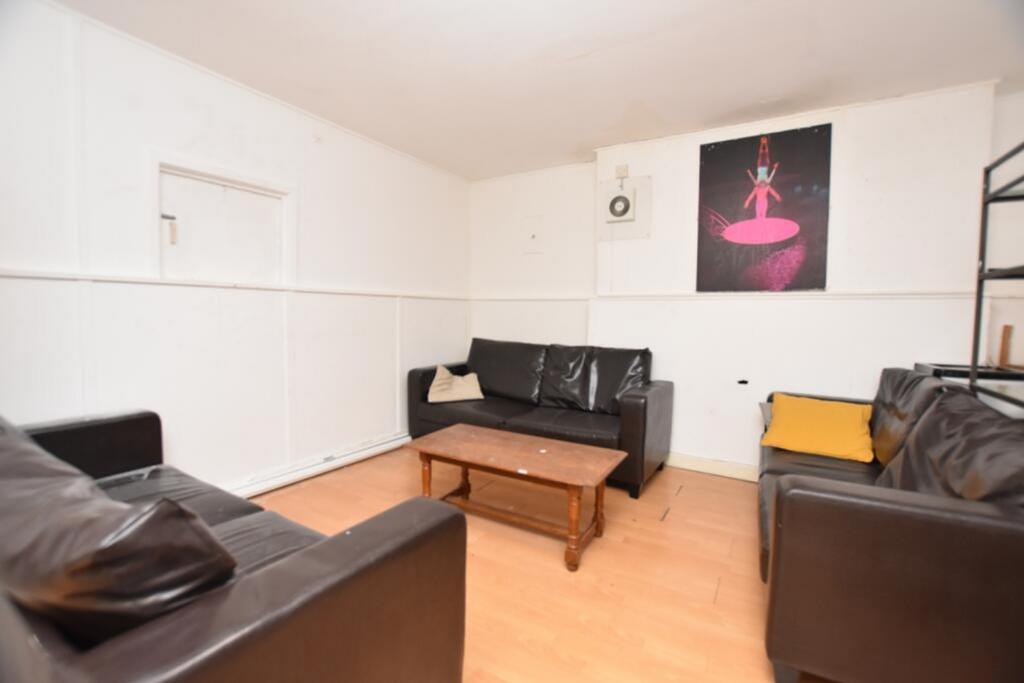 Spacious living room featuring comfortable seat...