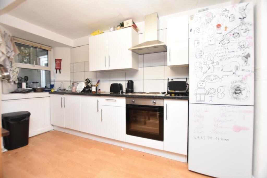 Spacious kitchen featuring modern appliances an...