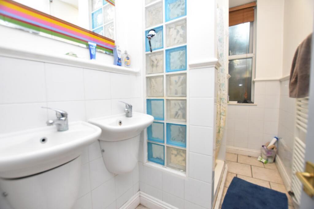 Modern bathroom featuring stylish fixtures and ...