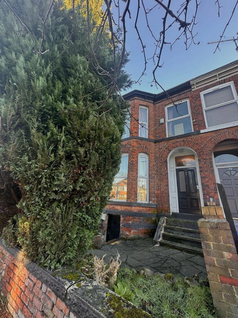 Charming front exterior of a classic brick prop...