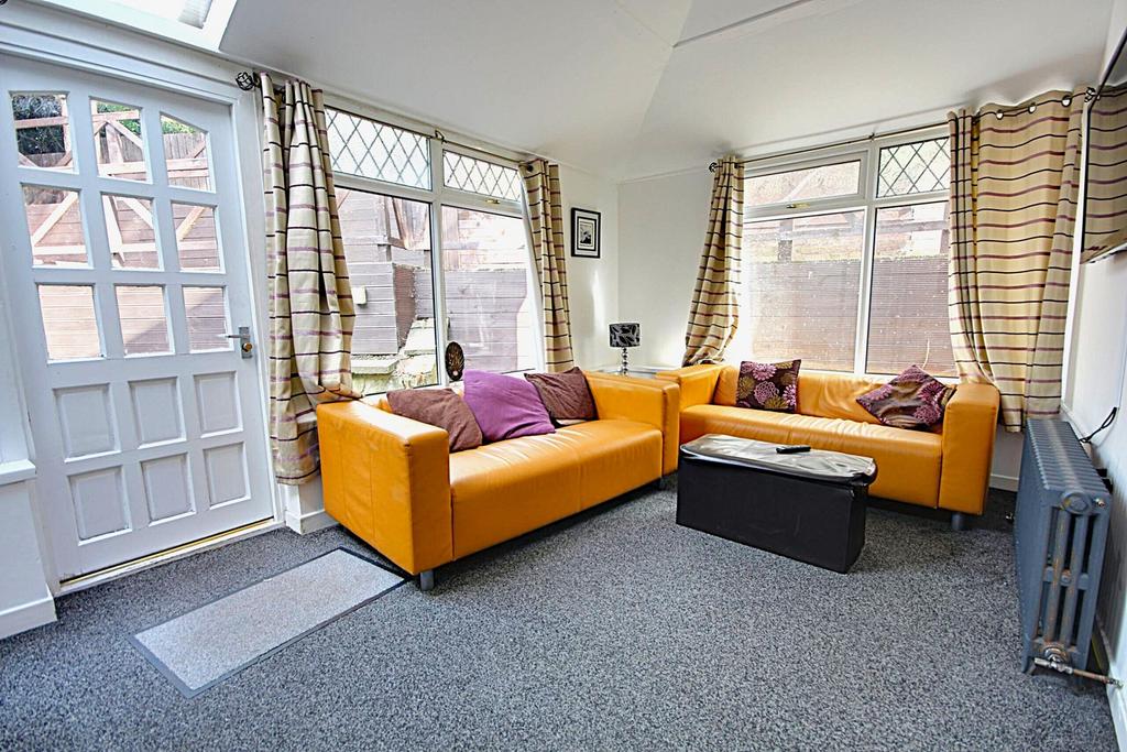 A bright and inviting large modern living room,...