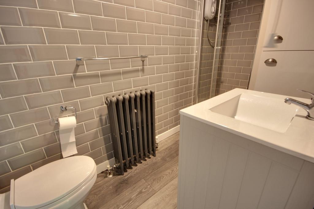 A modern and stylish bathroom featuring contemp...