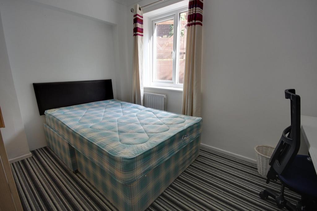 A bright and spacious double bedroom with ample...