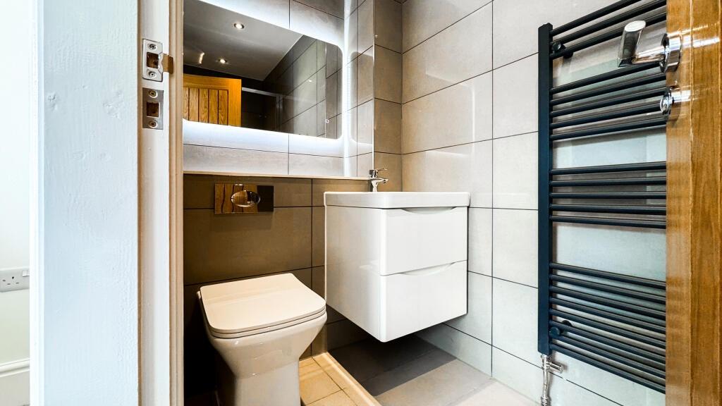 Stylish and modern bathroom featuring sleek fix...
