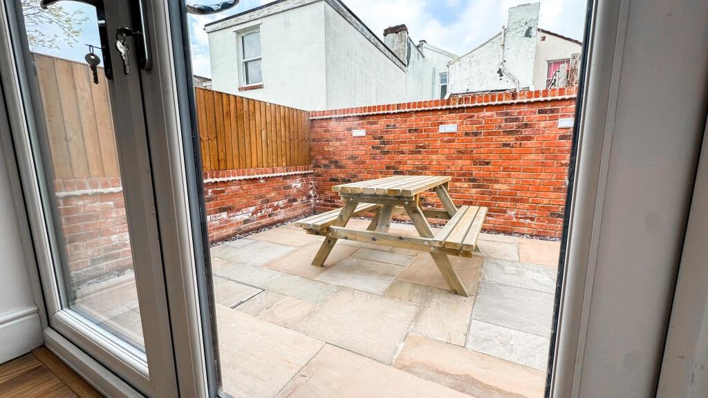Enjoy a charming outdoor space featuring a well...