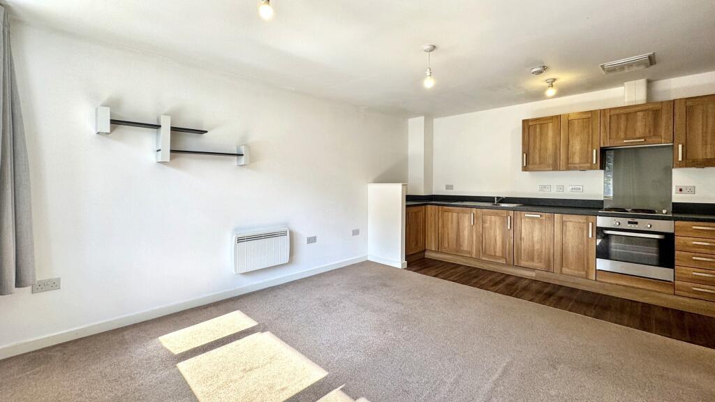 Bright and functional kitchen area featuring mo...