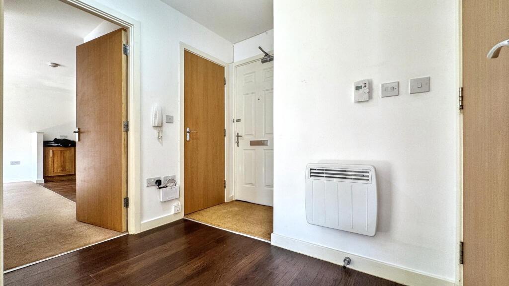 A welcoming hallway featuring modern decor and ...