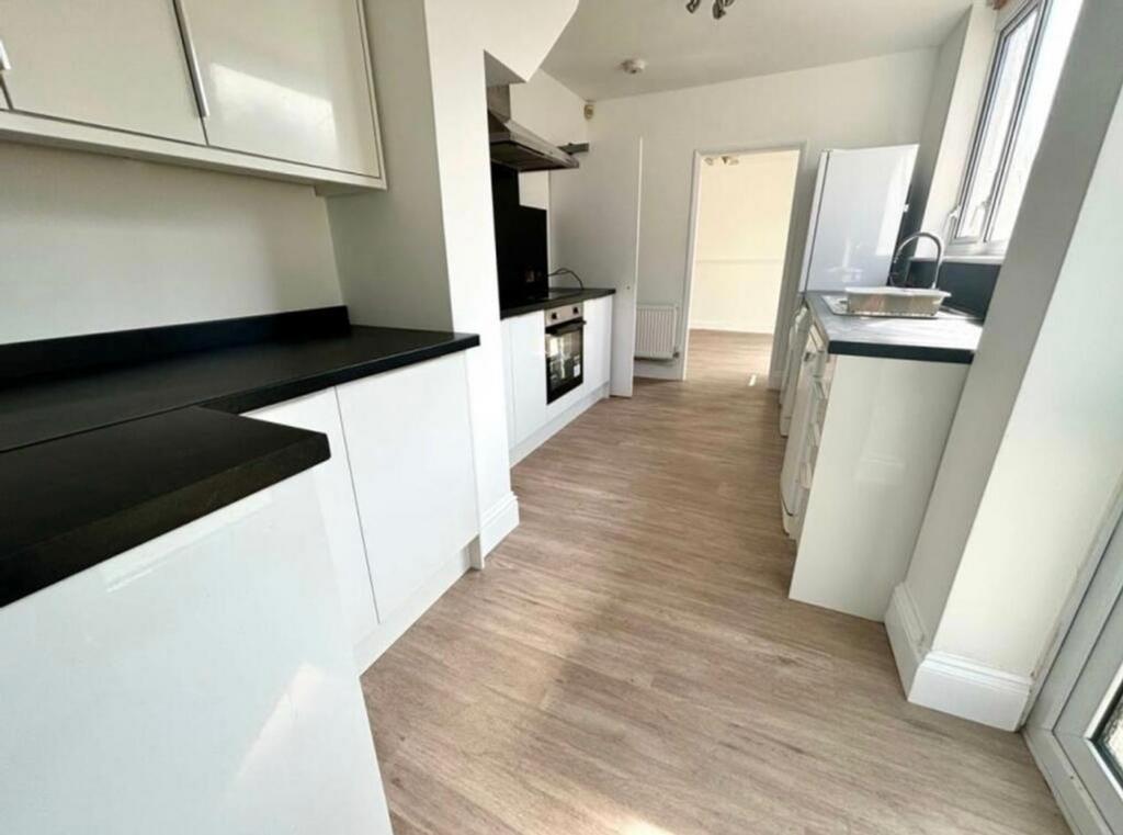 A bright and modern kitchenette featuring sleek...