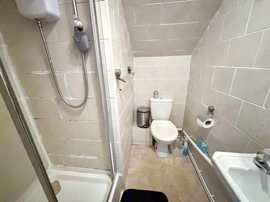 A well-maintained bathroom featuring a modern s...