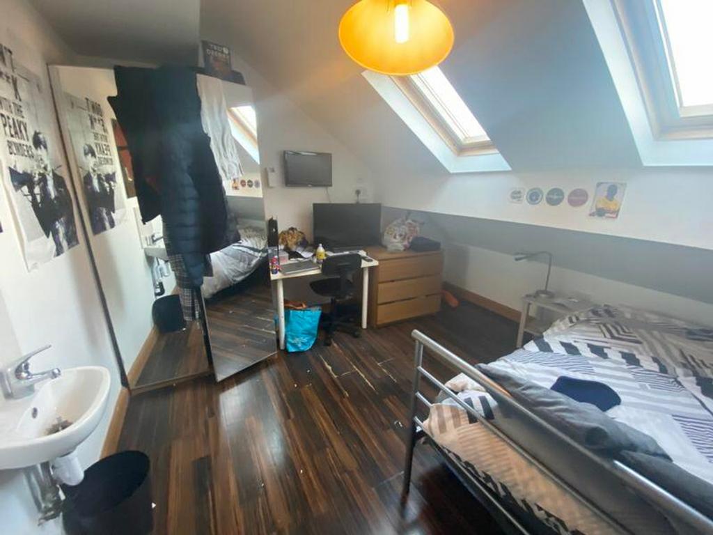 A bright and inviting double bedroom featuring ...