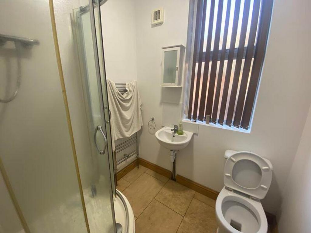 A tidy and well-lit bathroom featuring a modern...
