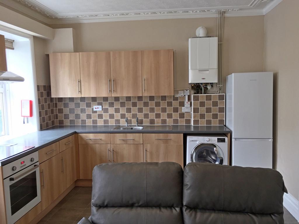 This modern kitchen features a stylish layout w...