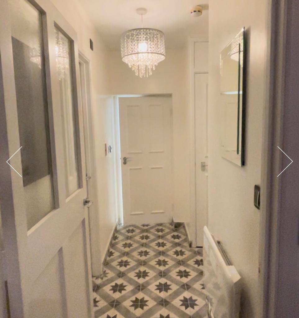 A stylish and well-maintained hallway with eleg...