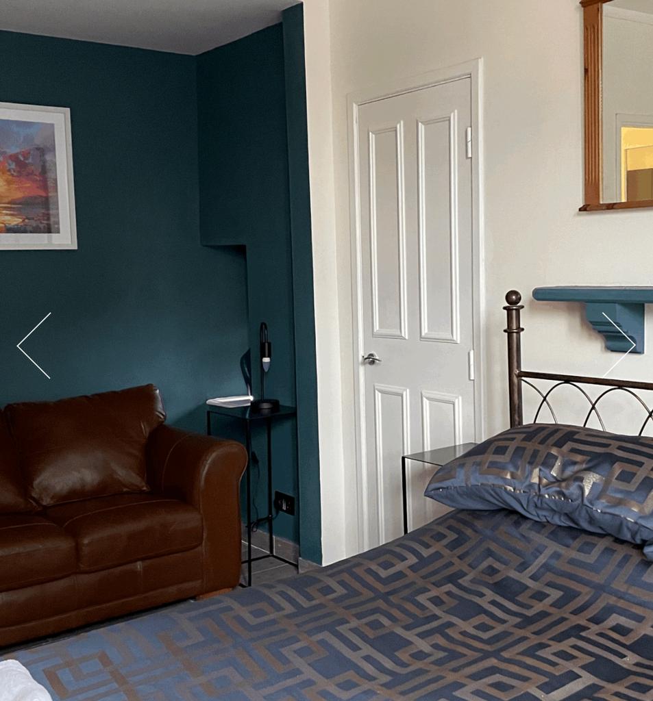 A cozy and inviting double bedroom featuring a ...