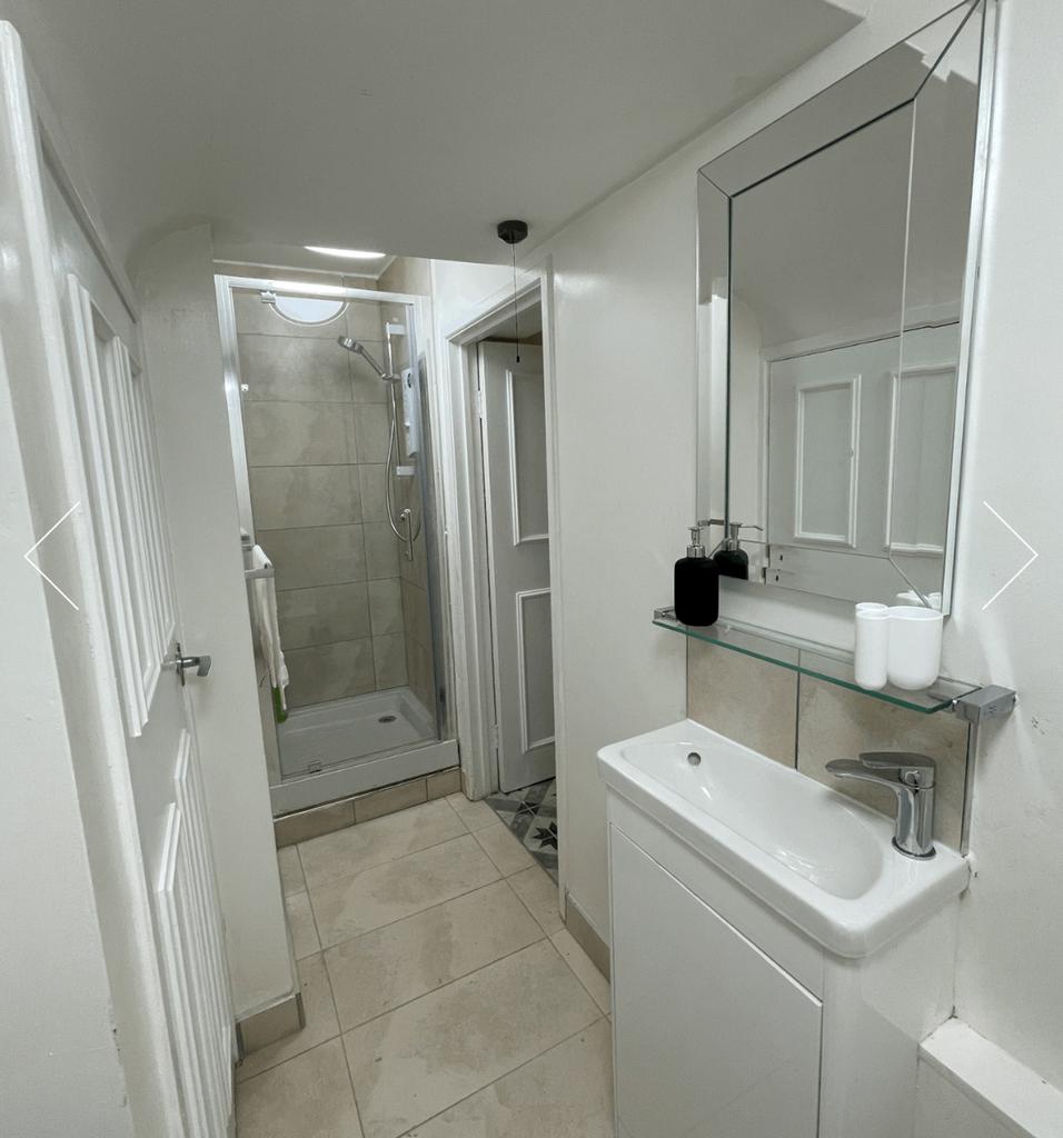A modern and immaculate bathroom featuring a sp...