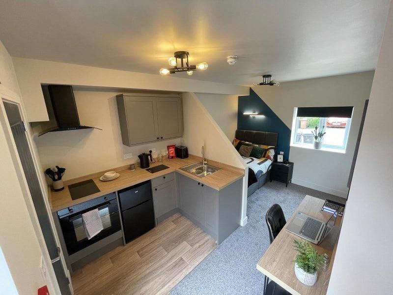 Bright and modern studio apartment featuring a ...