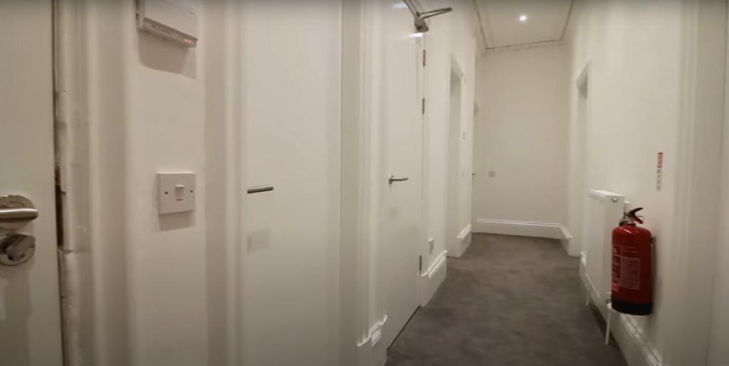 A clean and well-maintained hallway featuring m...