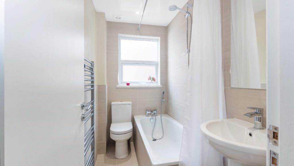 Modern bathroom suite featuring a comfortable b...