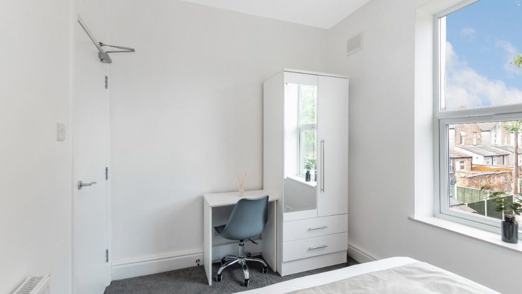 Bright and inviting double bedroom featuring a ...