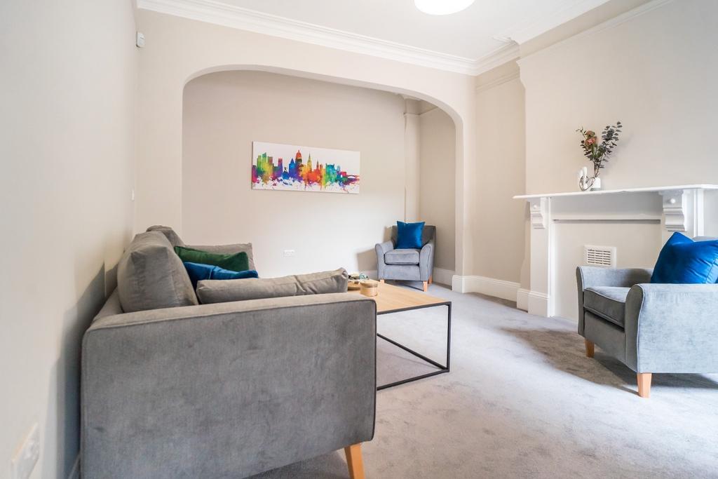 A stylish and inviting living room featuring co...