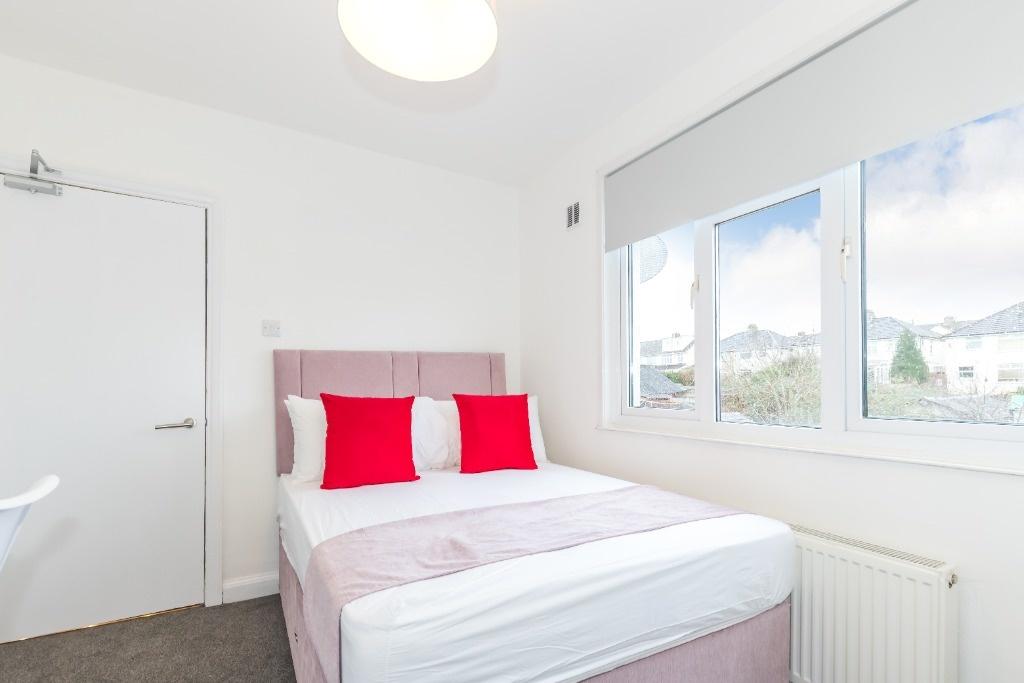 Bright and inviting double bedroom featuring a ...