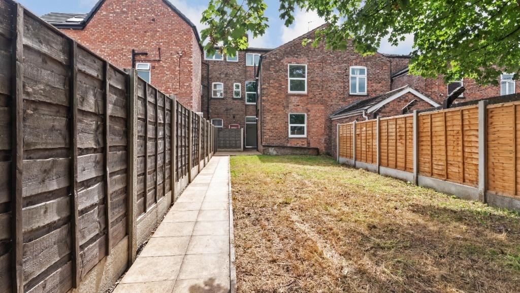 A beautifully maintained garden space featuring...