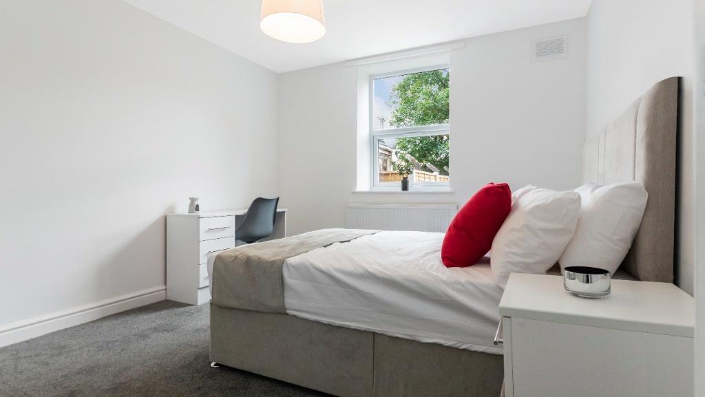 Bright and inviting double bedroom featuring a ...