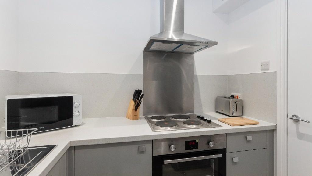Modern kitchen featuring sleek appliances and a...
