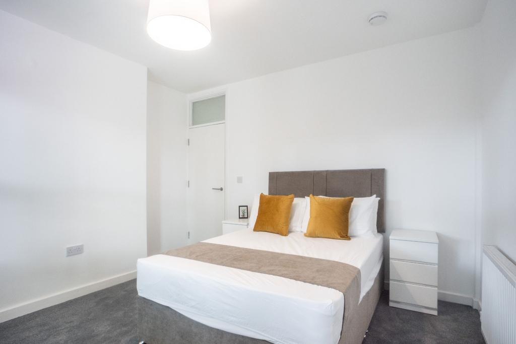 This inviting double bedroom features a stylish...