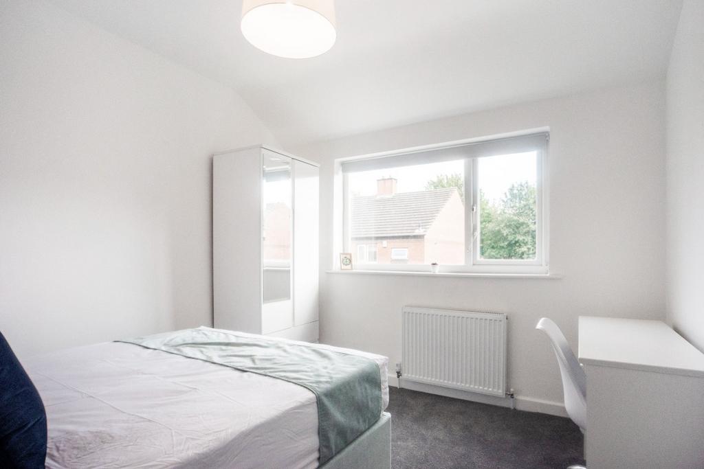 Bright and cozy double bedroom featuring ample ...