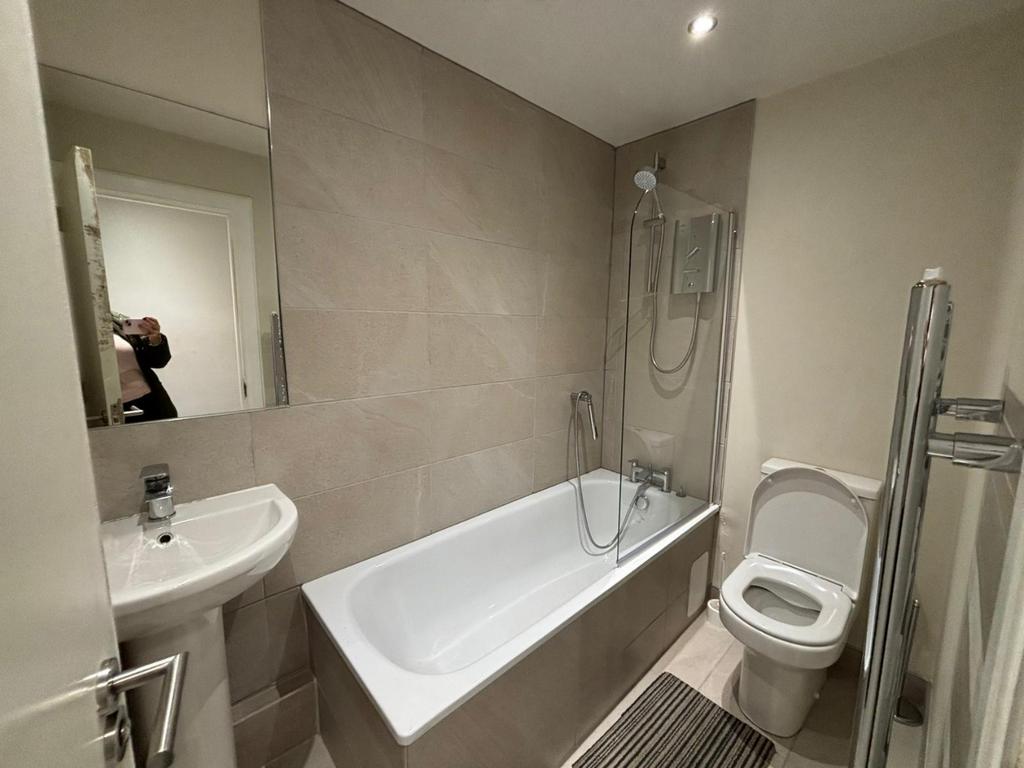 A modern bathroom featuring a sleek design with...