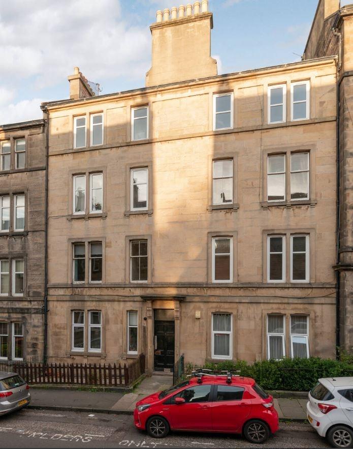 Charming front view of a classic building, feat...