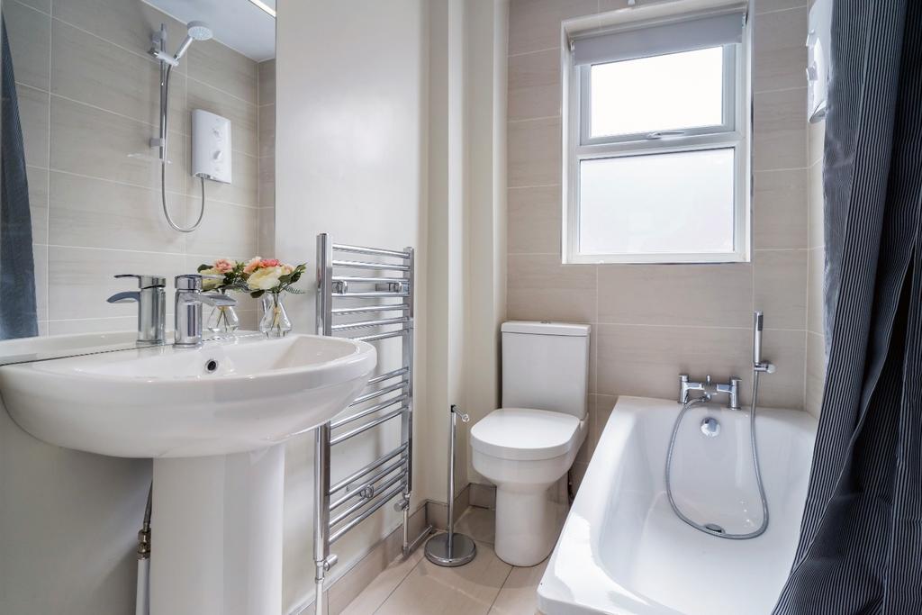 This modern bathroom features a sleek design wi...