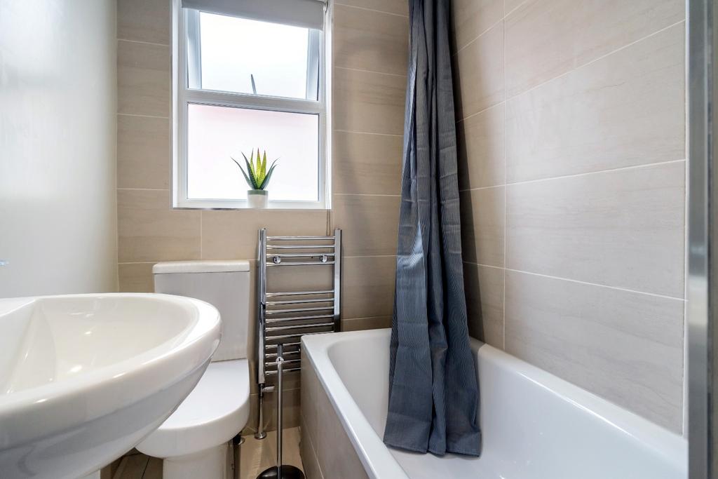 This modern bathroom features a clean design wi...