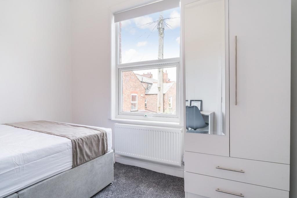 Bright and inviting double bedroom featuring a ...