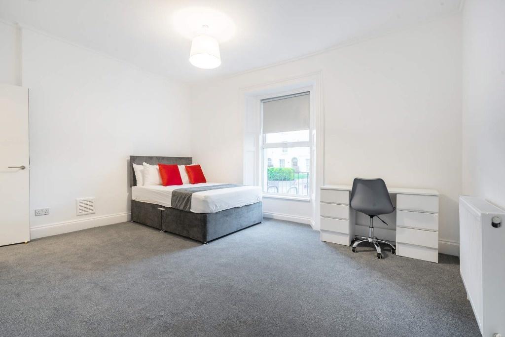 Bright and inviting double bedroom featuring a ...