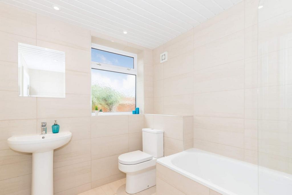 A beautifully designed bathroom featuring a mod...